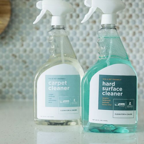 two bottles of cleaning solution on kitchen counter